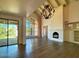 Spacious living room with hardwood floors, fireplace, and high ceilings at 10120 E Topaz Dr, Scottsdale, AZ 85258