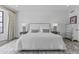 Bright main bedroom featuring a large bed, modern nightstands and an area rug at 10120 E Topaz Dr, Scottsdale, AZ 85258