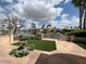 Relaxing flagstone patio with manicured lawn and water views at 10120 E Topaz Dr, Scottsdale, AZ 85258