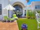 Relaxing outdoor space featuring comfortable lounge chairs, an umbrella, and a beautiful building view at 10120 E Topaz Dr, Scottsdale, AZ 85258