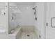 Elegant bathroom featuring a glass enclosed shower with bench seating and modern fixtures at 10120 E Topaz Dr, Scottsdale, AZ 85258