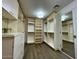 Large walk-in closet with ample shelving and drawers at 10120 E Topaz Dr, Scottsdale, AZ 85258