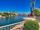 Scenic water view of canal with homes and palm trees at 10120 E Topaz Dr, Scottsdale, AZ 85258