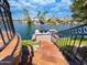 Stunning waterfront property with a private dock, a boat, and beautiful landscaping, ready for fun at 10120 E Topaz Dr, Scottsdale, AZ 85258
