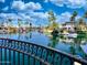 Waterfront view from balcony featuring palm trees, calm water, and neighborhood at 10120 E Topaz Dr, Scottsdale, AZ 85258