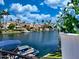 Waterfront view of palm trees and boats from covered patio at 10120 E Topaz Dr, Scottsdale, AZ 85258