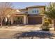 Beautiful two-story home showcasing its manicured landscaping and welcoming curb appeal at 10129 E Ampere Ave, Mesa, AZ 85212