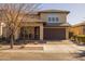 Charming two-story home with a well-maintained yard, two car garage, and a covered entry at 10129 E Ampere Ave, Mesa, AZ 85212