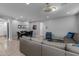 Bright living room features tile flooring, a dining area and comfortable seating at 10129 E Ampere Ave, Mesa, AZ 85212