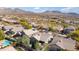 Expansive aerial view of a desert homes featuring tile roofs, private pools, and mountain views in a picturesque neighborhood at 10564 E Tierra Buena Ln, Scottsdale, AZ 85255