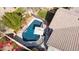 Aerial shot of backyard featuring a dark blue, fenced in pool with patio furniture, contrasted by green landscaping at 10564 E Tierra Buena Ln, Scottsdale, AZ 85255