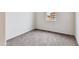 Small bedroom with neutral-colored carpet and a window at 1144 Se Mullberry St, Florence, AZ 85132