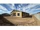 View of framed home with sheeting in a new construction build with surrounding desert landscape and clear sky at 11441 E Utopia Ave, Mesa, AZ 85212