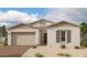 One-story home with neutral color scheme and a two-car garage at 11441 E Utopia Ave, Mesa, AZ 85212