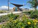 Community playground with shade structure and landscaping at 11441 E Utopia Ave, Mesa, AZ 85212