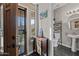 Entryway with half bathroom and decorative console table at 11849 N 51St Dr, Glendale, AZ 85304