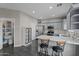 Modern kitchen with gray cabinets, granite countertops, and walk-in pantry at 11849 N 51St Dr, Glendale, AZ 85304