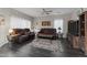 Living room with brown leather couches and a large TV at 11849 N 51St Dr, Glendale, AZ 85304