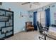 Home office with brown chair, desk, and ceiling fan at 11849 N 51St Dr, Glendale, AZ 85304