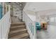 Staircase with white railing and built-in shelving at 11849 N 51St Dr, Glendale, AZ 85304