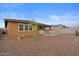 Spacious backyard with gravel and a covered patio area at 11995 E Pivot Peak --, Gold Canyon, AZ 85118