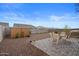 Spacious backyard with patio furniture, shed, and gravel landscaping at 11995 E Pivot Peak --, Gold Canyon, AZ 85118