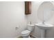 Small bathroom with a toilet and a pedestal sink at 11995 E Pivot Peak --, Gold Canyon, AZ 85118