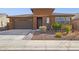 Single-story home with two-car garage and desert landscaping at 11995 E Pivot Peak --, Gold Canyon, AZ 85118