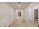 Bright hallway with wood-look tile flooring, leading to the main living areas at 11995 E Pivot Peak --, Gold Canyon, AZ 85118