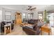 Spacious living room with leather sofas and ceiling fan at 11995 E Pivot Peak --, Gold Canyon, AZ 85118