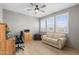 Home office with wood desk, comfortable couch, and natural light at 11995 E Pivot Peak --, Gold Canyon, AZ 85118