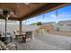 Relaxing covered patio with wicker furniture and hanging decorations at 11995 E Pivot Peak --, Gold Canyon, AZ 85118