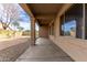 Covered patio with view of the backyard and a gravel area at 13756 W Watson Ln, Surprise, AZ 85379