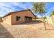 Large backyard with gravel ground cover and a partially visible fence at 13756 W Watson Ln, Surprise, AZ 85379