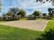 Sand volleyball court with net and surrounding grass at 13756 W Watson Ln, Surprise, AZ 85379