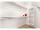 Bright walk-in closet with shelving and hanging rods at 13756 W Watson Ln, Surprise, AZ 85379