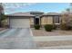 Charming single-story home features a two-car garage and well-maintained landscaping at 15704 W Taylor St, Goodyear, AZ 85338