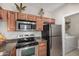 Kitchen with stainless steel appliances and laundry at 16013 S Desert Foothills Pkwy # 2095, Phoenix, AZ 85048