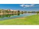 Community lake view with homes reflected in water at 16013 S Desert Foothills Pkwy # 2095, Phoenix, AZ 85048