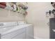 Laundry room with washer, dryer, and shelving at 16013 S Desert Foothills Pkwy # 2095, Phoenix, AZ 85048