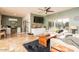 Living room with light-colored sofas and a rustic coffee table at 16043 W Copper Crest Ln, Surprise, AZ 85374