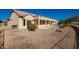 House's backyard is partially visible with gravel and a rock garden at 16331 W Willow Creek Ln, Surprise, AZ 85374