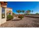 Landscaped backyard with desert plants and gravel at 16331 W Willow Creek Ln, Surprise, AZ 85374