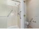 Bathroom with walk in shower and grab bars at 16331 W Willow Creek Ln, Surprise, AZ 85374