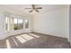 Bedroom featuring bay windows and carpeted floor at 16331 W Willow Creek Ln, Surprise, AZ 85374