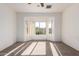 Bedroom with carpeted floors, bay windows, and a ceiling fan at 16331 W Willow Creek Ln, Surprise, AZ 85374