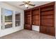 Bedroom boasts built-in shelving and storage, plus large windows at 16331 W Willow Creek Ln, Surprise, AZ 85374