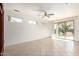 Bright dining room with sliding glass doors and tile floor at 16331 W Willow Creek Ln, Surprise, AZ 85374