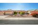 One-story house with desert landscaping and a two-car garage at 16331 W Willow Creek Ln, Surprise, AZ 85374