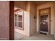 Front entrance with a security door and a decorative mat at 16331 W Willow Creek Ln, Surprise, AZ 85374